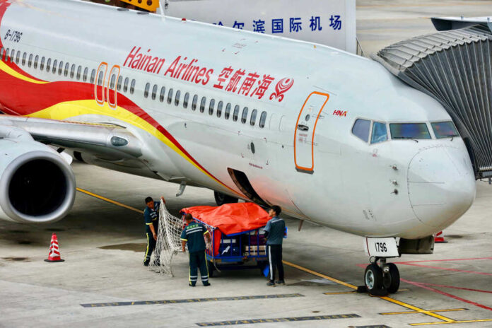 ?haerbing,,China/july,20,2019?a,Airplane,Of,Hainan,Airlines,Staying,At,Airport.