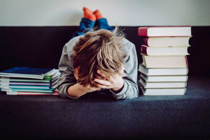 Little,Boy,Tired,Stressed,Of,Doing,Homework