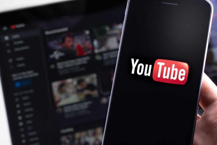 Youtube,Logo,On,The,Screen,Smartphone,And,Homepage,On,The