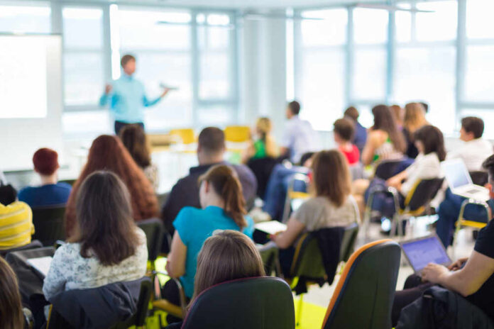 Speaker,At,Business,Workshop,And,Presentation.,Audience,At,The,Conference