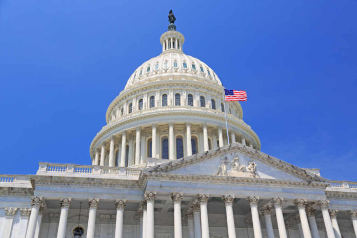 National,Capitol,Building,With,Us,Flag,,Washington,Dc