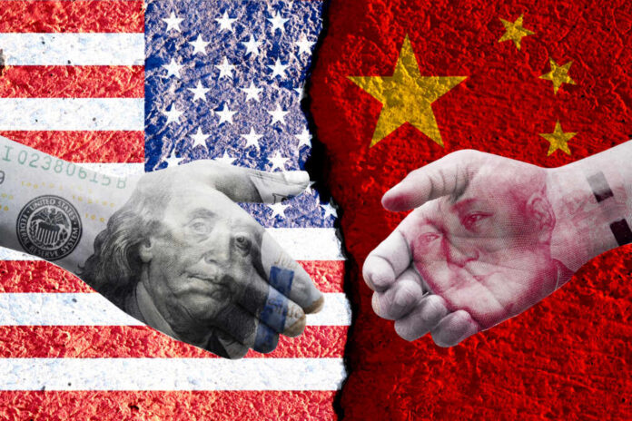 Us,Dollar,And,China,Yuan,Banknote,Print,Screen,On,Handshake