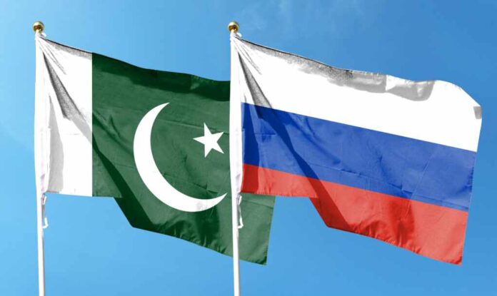 Russia,Flag,With,Pakistan,Flag,On,Cloudy,Sky.,Fluttering,In
