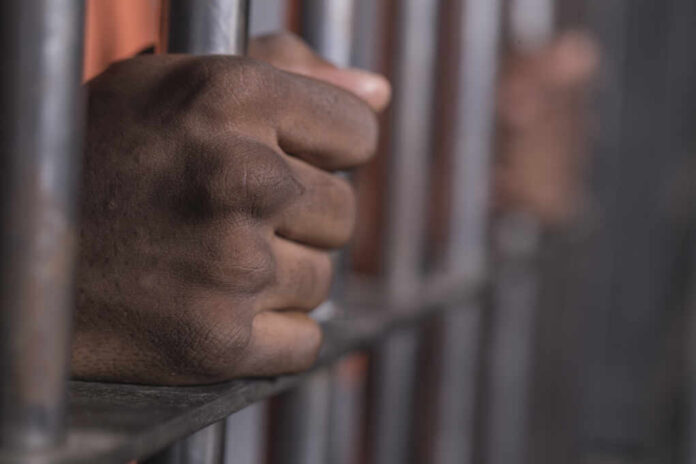 People,In,Jail,-,African,American,Man,Behind,Bars