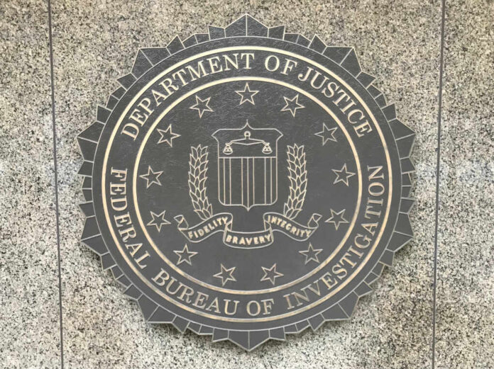 U.s.,Department,Of,Justice/fbi,Emblem,On,The,Outside,Entrance,Wall