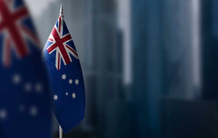Small,Flags,Of,Australia,On,A,Blurry,Background,Of,The
