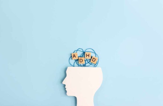 Silhouette,Of,Human,Head,And,Wooden,Blocks,With,The,Letters