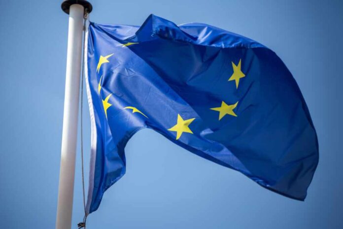 Flag,Of,The,European,Union,In,Front,Of,A,Blue