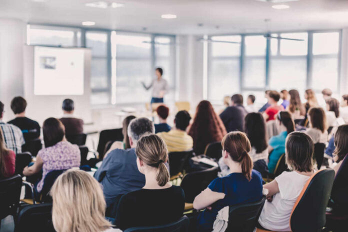 Business,And,Entrepreneurship,Symposium.,Speaker,Giving,A,Talk,At,Business