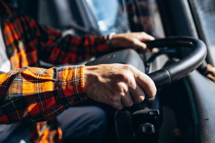 Man,Trucker,Driving,In,A,Cabin,Of,His,Truck