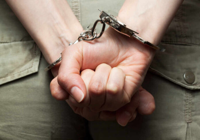 Dramatic,Photograph,Of,Woman´s,Hands,In,Handcuffs,(close-up)