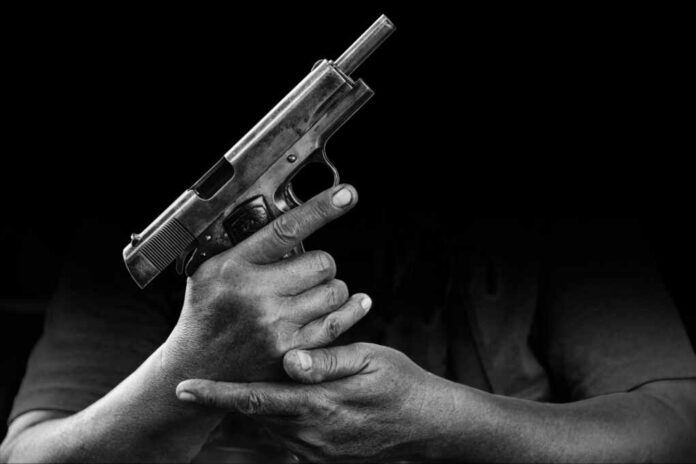 The,Hand,Of,The,Man,Caught,The,Gun,In,A