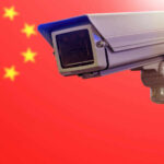Google Busts Massive Chinese Espionage Network Surveillance camera in front of the Chinese flag