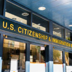 Entrance of the U.S. Citizenship and Immigration Services office with signage