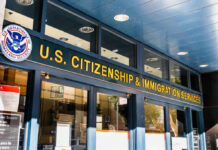 Entrance of the U.S. Citizenship and Immigration Services office with signage