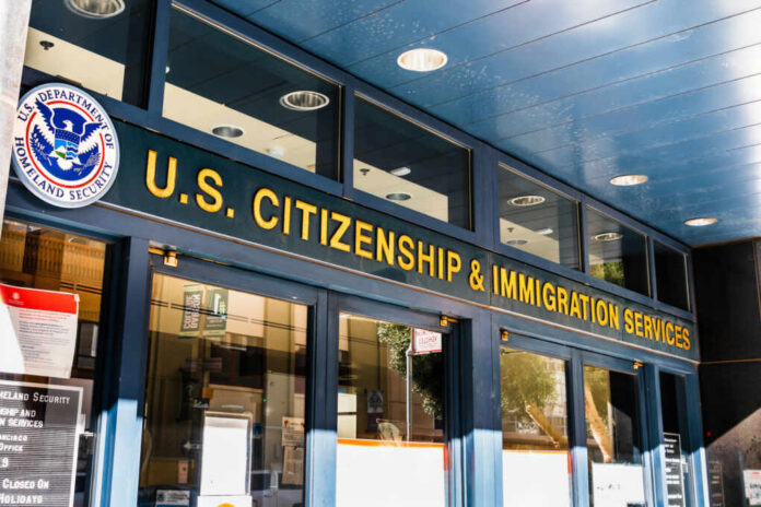 Entrance of the U.S. Citizenship and Immigration Services office with signage