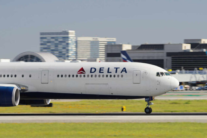 Delta Airlines airplane taxiing on the runway at an airport