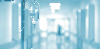 IV drip in a hospital corridor with a blurred background