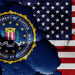 FBI Firings Spark Iran Threat Concerns FBI emblem partially obscured by a cracked wall with an American flag background