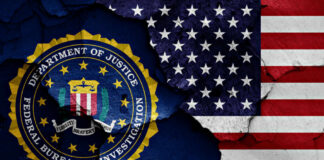 FBI emblem partially obscured by a cracked wall with an American flag background