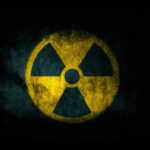 Radiation symbol on a textured dark background