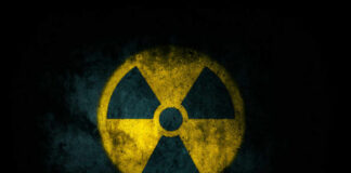 Radiation symbol on a textured dark background