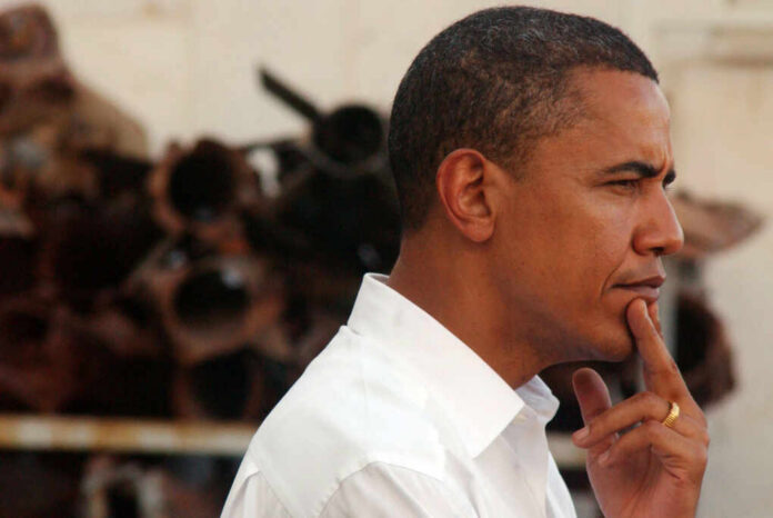 Profile view of a man in a white shirt with a thoughtful expression