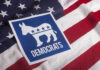 Democratic Party logo featuring a donkey on an American flag background