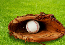 Team USA Fans SLAM Tigers Ace Skubal A baseball glove with a baseball resting inside, set on green grass