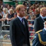 Royal Family SHOCK: Psychic Predicts Health Crisis Members of a royal procession walking in formal attire during a public event