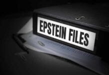 A black binder labeled 'Epstein Files' with papers and a pen beside it