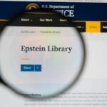 Magnifying glass focusing on the Epstein Library section of a government website