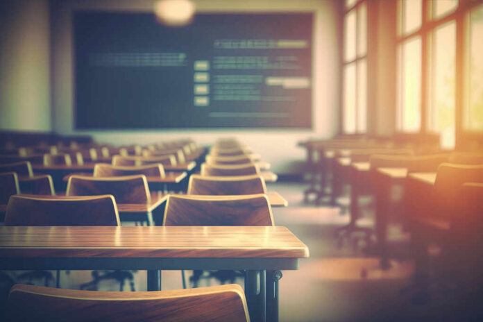 Empty classroom with wooden desks and chairs, illuminated by natural light