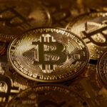 Close-up of multiple Bitcoin coins stacked together