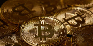 Close-up of multiple Bitcoin coins stacked together