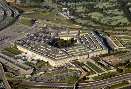Aerial view of the Pentagon building surrounded by roads and greenery