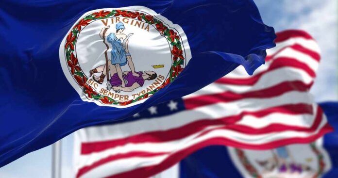 Virginia state flag waving in the foreground with an American flag in the background