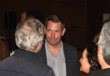 Group of people engaged in conversation at an event