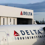 Midair Miracle: Baby Born on Delta Flight Close-up of a Delta Airlines airplane at an airport with the Delta logo visible