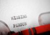 Close-up of a typewritten document with the words 'MISSING PERSON'