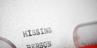 Close-up of a typewritten document with the words 'MISSING PERSON'