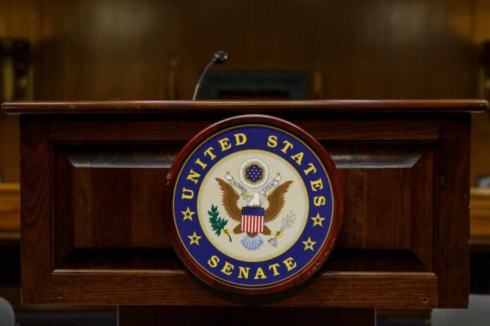 shutterstock_2379495893.jpg Podium with the United States Senate seal in a formal setting