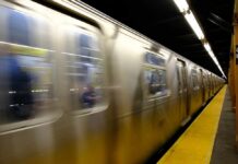 Garbage Truck vs. Train: Unbelievable Escape A subway train in motion at a station with blurred reflections