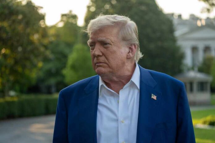 shutterstock_2645176751.jpg A political figure with a serious expression standing outdoors near the White House