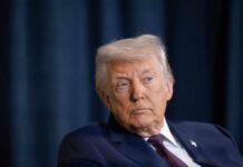 Constitutional Crisis: Trump’s DHS Payment Order Donald Trump with a serious expression during a media appearance