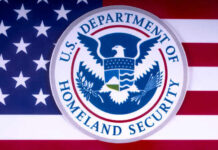 U.S. Department of Homeland Security emblem on a background of the American flag