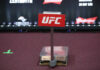 UFC weighing scale with a red sign in front