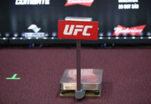 UFC weighing scale with a red sign in front