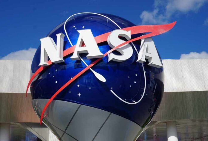 NASA logo displayed on a large blue globe against a clear sky