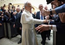 AI Disarmament Clash: Vatican vs. U.S. Defense Pope interacting with a crowd of people taking photos